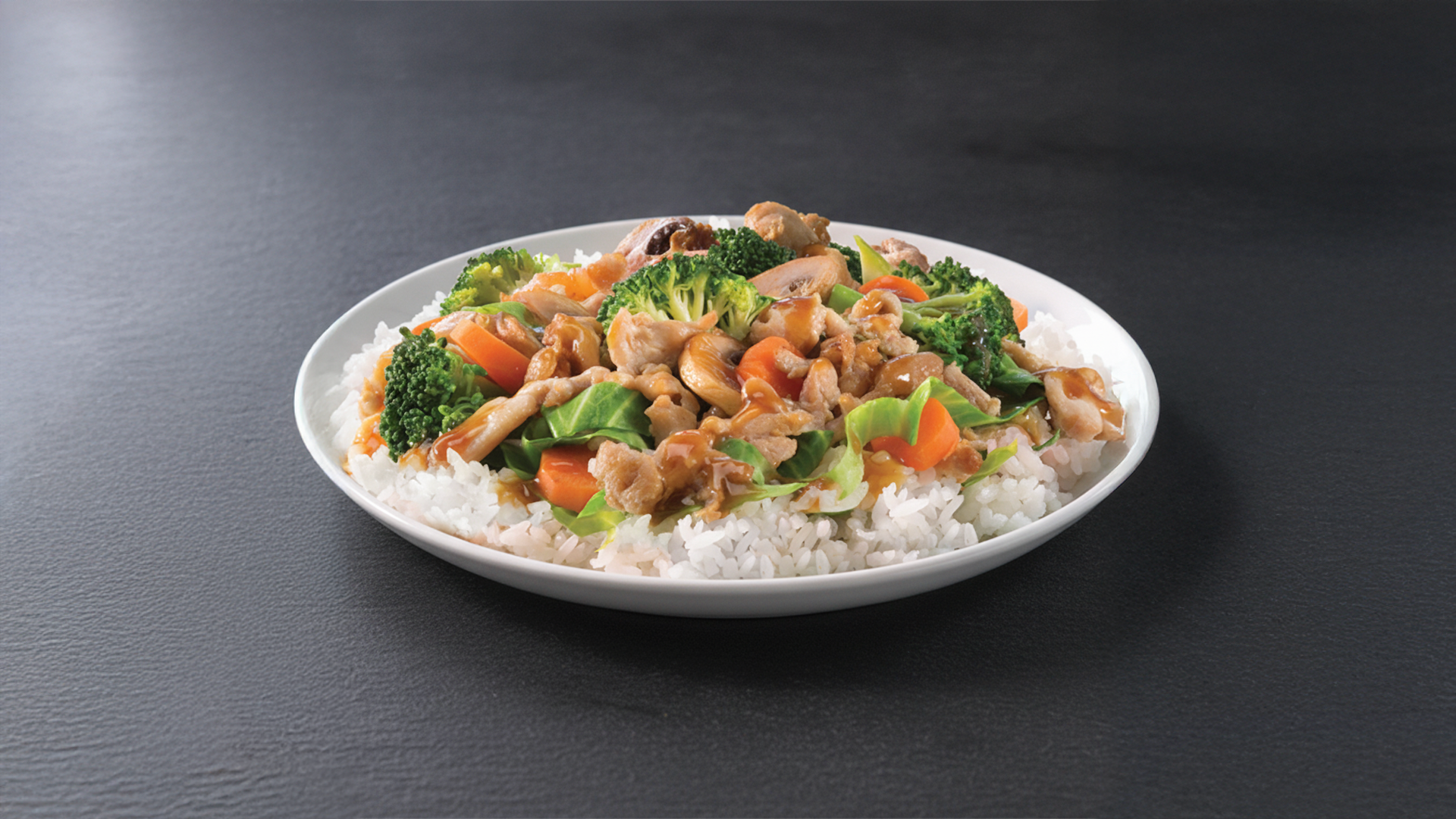 After: AI enhanced food photo on black slate — professional restaurant dish photography